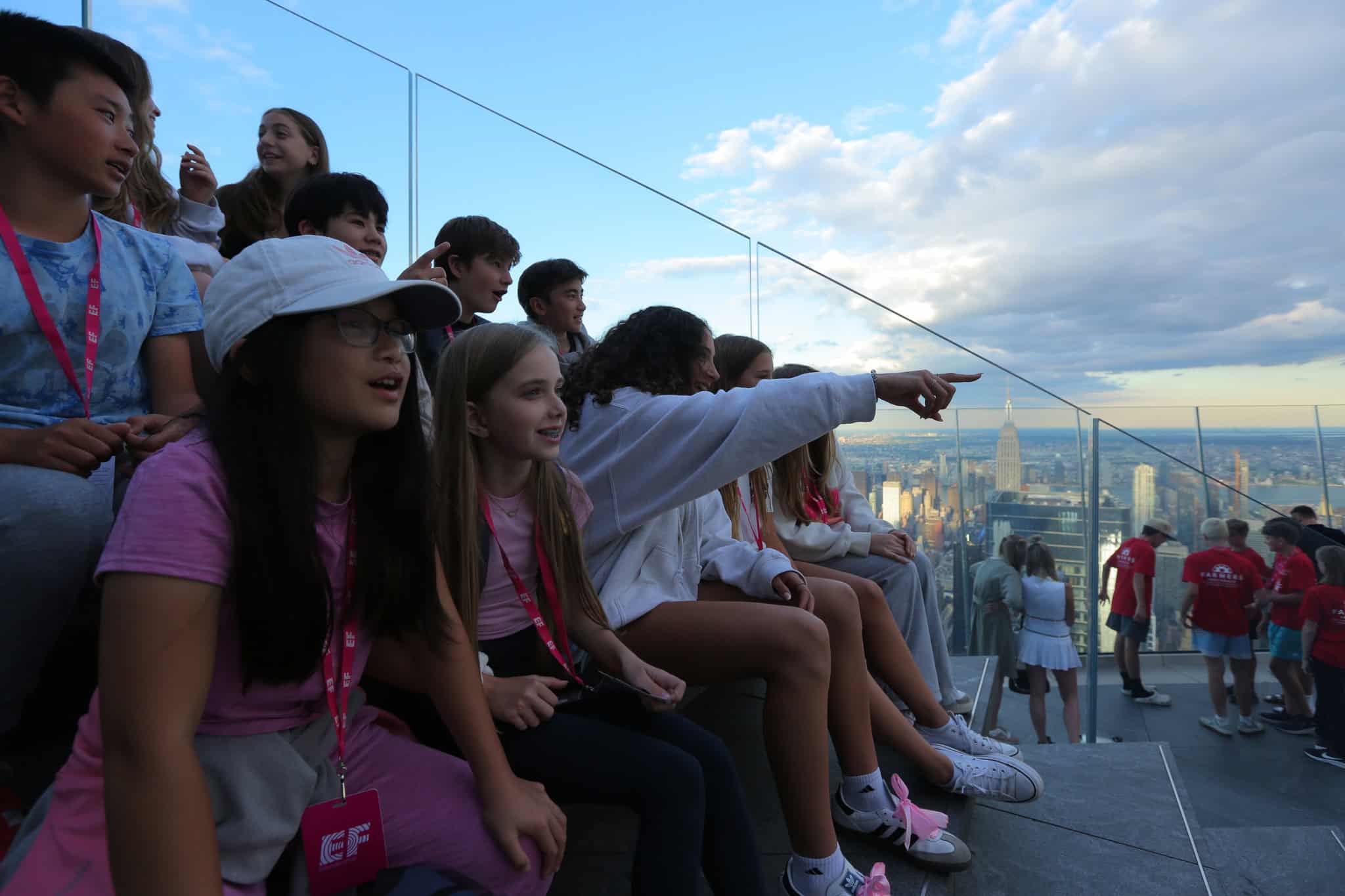Group of kids on the Edge steps overlooking the city views